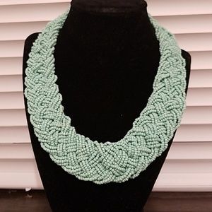 Turquoise beaded and braided necklace.